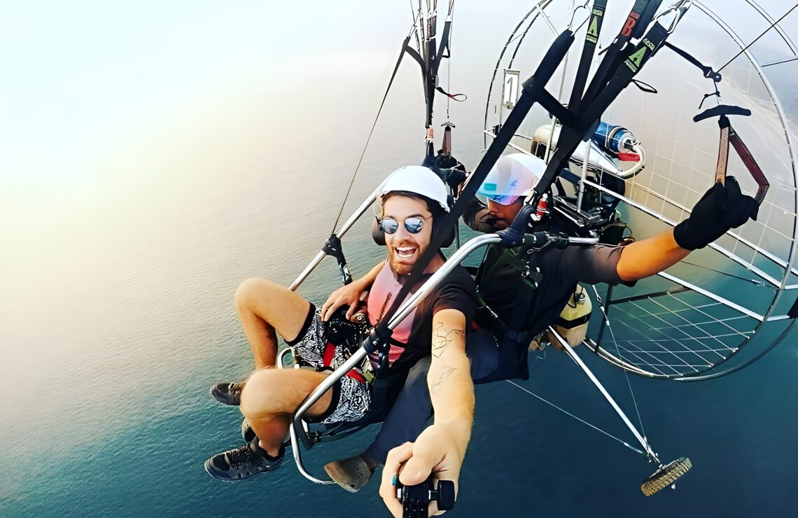 Flying Safari coastal paramotor take-off scene