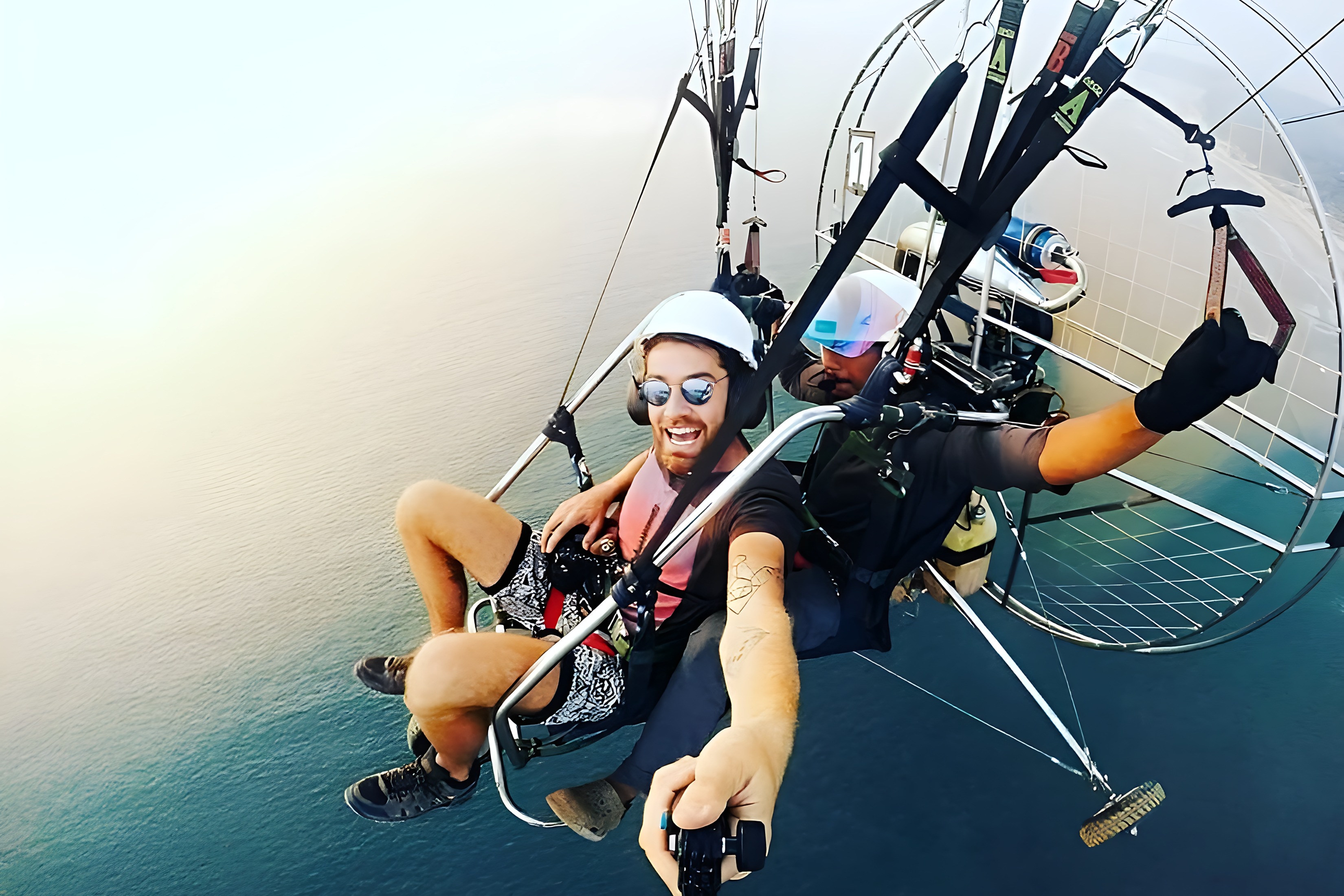 Smiling guest during a paramotoring flight in Goa